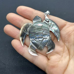 Natural black shell turtle pendant with iridescent luster and silver clasp for necklaces