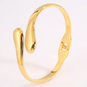 Bracelet jonc ouvert en acier titane doré en forme de goutte d'eau polie
