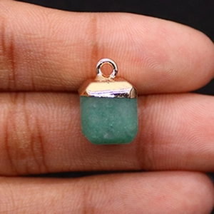 Macro shot of rectangular green aventurine stone pendant with rose gold metal clasp detail