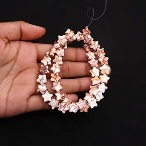 Macro detail of star-shaped natural stone beads with red marble texture for DIY jewelry