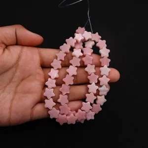 Macro detail of natural pink stone star beads for DIY jewelry necklace making