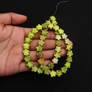 Detailed view of star-shaped imperial jasper beads in green and yellow for DIY jewelry