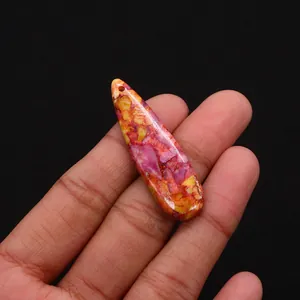 Close-up of polished tear-drop sea sediment jasper stone pendant with vibrant pink hues