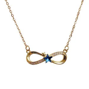 Golden infinity necklace with sparkling blue star gemstone and crystal inlay