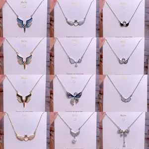 Collection de colliers en titane avec ailes de cœur et zircons en doré et argenté