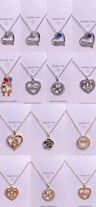 Colección de collares con colgante MOM en forma de corazón en oro y plata con cristales
