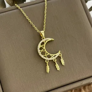 Chic golden titanium crescent moon dreamcatcher necklace with sparkling crystal feathers
