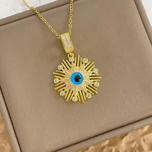 Evil eye sunburst pendant necklace in gold finish with blue enamel and zircon details