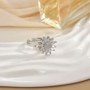 Detailed close-up of a rotating floral ring with marquise zircon petals and pavé setting