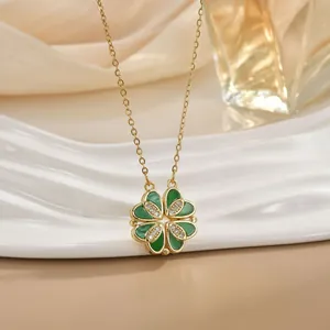 Elegant 18K gold plated clover necklace featuring green enamel and sparkling crystals