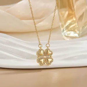 Golden heart-shaped four-leaf clover necklace with sparkling micro-set cubic zirconia stones
