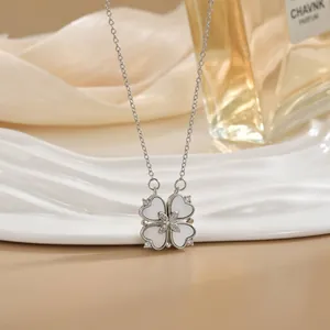 Versatile silver four-leaf clover necklace with white heart petals and starry zircon inlay