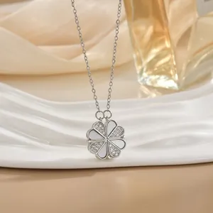 Golden clover pendant necklace with shimmering crystals and elegant mother of pearl inlays