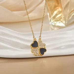 Elegant four-leaf clover pendant necklace with black enamel and white zircon on gold chain