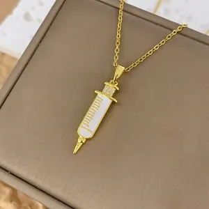 Gold-plated 18k necklace with creative medical syringe pendant and white enamel accents