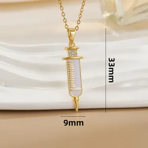 18k gold plated syringe pendant necklace with white enamel and sparkling zircons