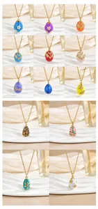 Detail of Faberge-style enamel egg pendants with zircons on 18K gold-plated chains