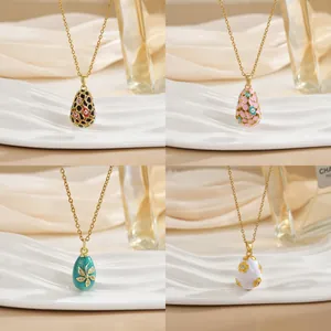 Enameled egg pendants in 18K gold plated necklaces featuring zircon floral patterns