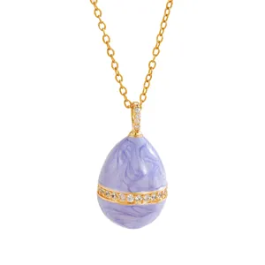 Enameled egg pendant necklace in purple and gold with sparkling zircon stones