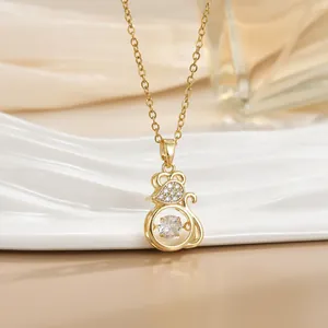 Detailed view of the dancing stone mouse pendant in gold finish with zircon crystals