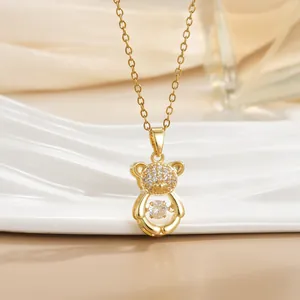Sparkling gold teddy bear necklace with dancing zircon stones and crystal paving