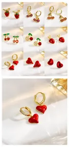 Detail of 18K gold plated hoop earrings with strawberry, cherry and heart enamel designs