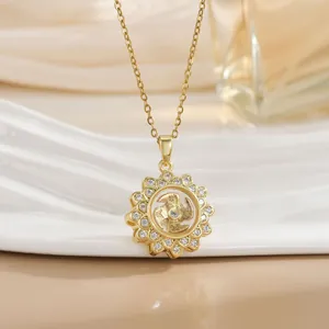 Macro detail of a spinning sunflower necklace with gold plating and cubic zirconia