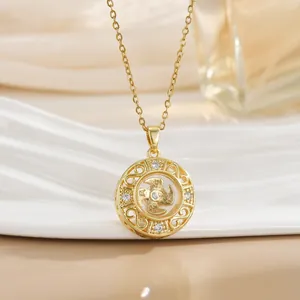 Rotating four-leaf clover pendant necklace in gold with auspicious symbols and zircon stones