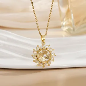 Macro shot of gold rotating sunflower necklace with pavé marquise-cut zircon stones