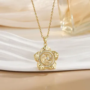 Close-up of golden spinning flower necklace with zircon inlay and lucky character