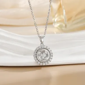 Close-up of rotatable spinning pendant with crystal border and Chinese characters