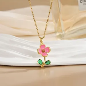 Elegant 18k gold plated necklace with pink flower pendant and green leaf gems