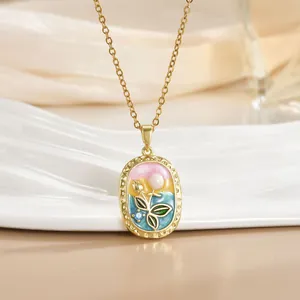 Vintage enamel necklace with gold floral relief and baroque pearl in soft colors