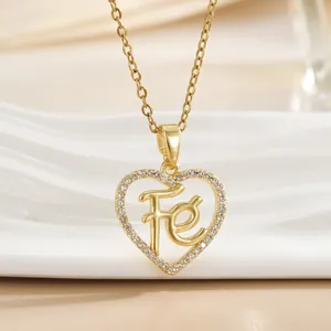 Golden heart pendant necklace with micro-paved crystals and Fe letter engraving
