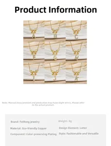 Detail view of gold-plated bow necklace with cubic zirconia letter pendant and specs