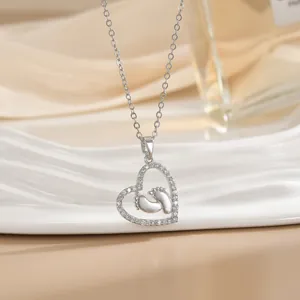Silver heart pendant necklace with baby footprints and crystals for Mother's Day