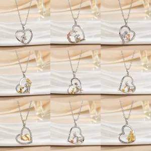 Collection of nine silver heart pendant necklaces with sentimental engravings for mothers