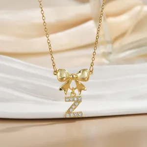Macro shot of gold bow necklace with letter Z pendant and inlaid cubic zirconia