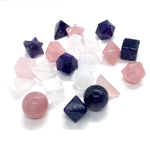 Sacred geometry set with amethyst rose quartz and clear crystal stones on white background
