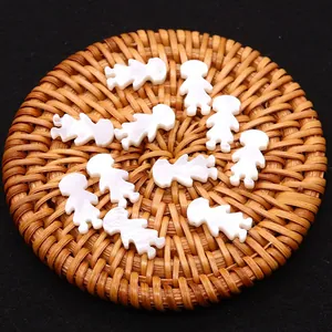 Natural white mother of pearl shell doll beads for DIY jewelry making on woven tray