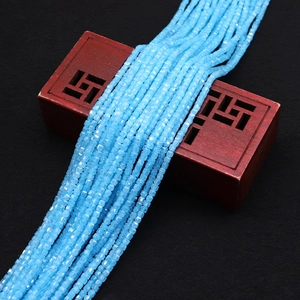 Macro shot of light blue faceted square zircon beads for DIY jewelry making and necklaces