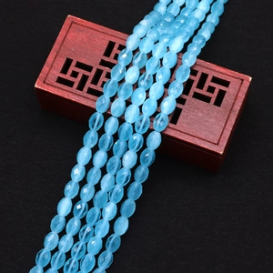 Detail of faceted oval light blue cat eye stone beads for DIY jewelry making