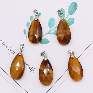 Set of five faceted tiger eye teardrop pendants with polished metallic bails