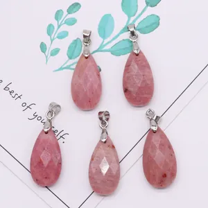 Detailed macro view of five faceted pink teardrop natural stone pendants with silver clasps