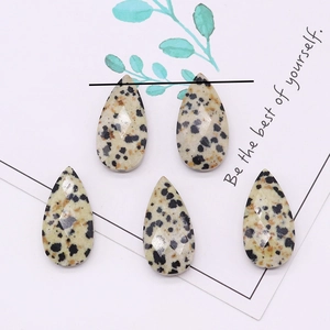 Macro shot of faceted teardrop dalmatian jasper beads for DIY jewelry making