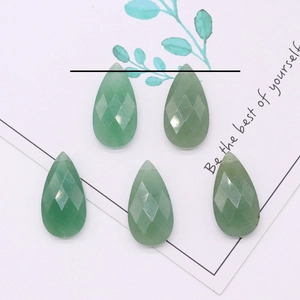 Macro detail of teardrop faceted green aventurine natural stone beads for jewelry making