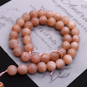 Polished natural orange moonstone round loose beads with shimmering sunstone effect