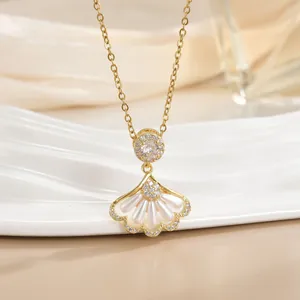 Elegant 18k gold plated necklace with shell-shaped pearl pendant and sparkling zircons