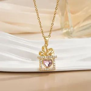 Detail of 18k gold plated necklace with pink heart gem in a zircon-studded gift box pendant