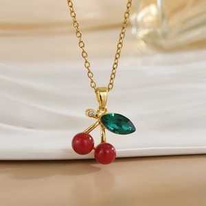 Elegant gold cherry pendant necklace with red beads and green gemstone leaf for women